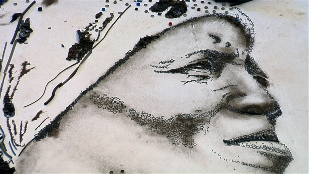 CLOSE-UP OF IRMA'S FACE IN PORTRAIT (SCREEN GRAB) Artwork courtesy of Vik Muniz Studio STILL
